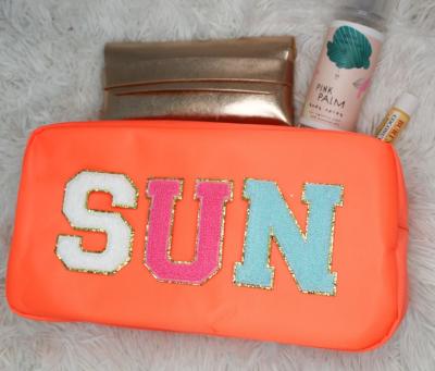 China Fashion Waterproof Nylon Toiletry Bag Personalized Cute Fabric Letter Patches Makeup Cosmetic Bag for sale