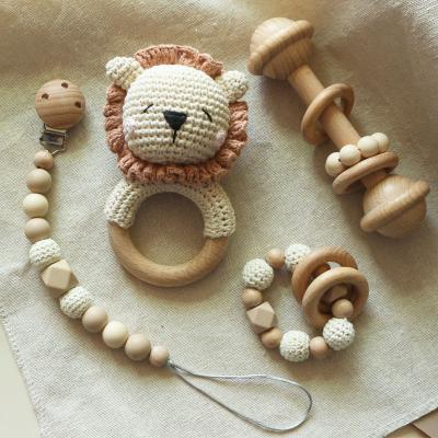 China 4Pcs Musical Set Organic Teether Ring Wood Rattle Baby Teether Cotton Lion Handmade Crochet Eco Wooden Toys Cute Animals Teether for sale