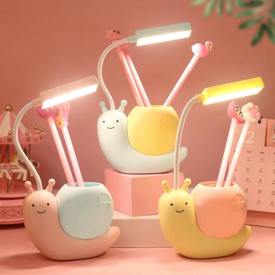 China Desk Plastic Lights With Pen Storage Box Cartoon Charging Light LED Learning Eye Protection Lamp Snails Table Lamp Kids Gift Night Light for sale