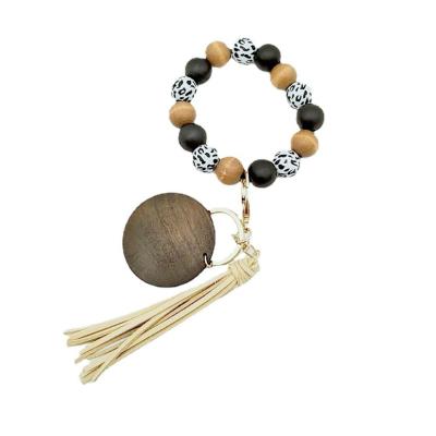 China Waterproof a variety of new style leopard wood bead bracelets, key chains, disc tassels for sale