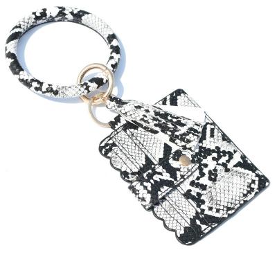 China Fashion waterproof bracelet, key chain, leopard print, PU leather tassel, women's change purse, card bag, wrist pendant for sale