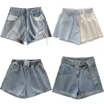 China Breathable Women's Asymmetric Waist High Ripped Jean Shorts Vintage Summer Edge Hot Pants Distressed Denim Shorts for sale