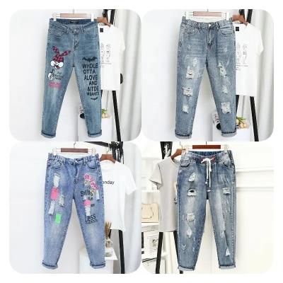 China Breathable Women Stretch High Waisted Ripped Jeans Fringed Raw Edge Distressed Denim Pants With Hole for sale