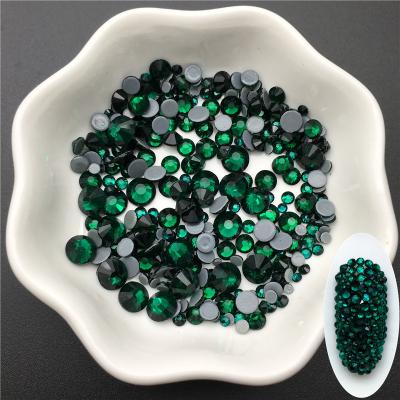 China Hot Selling Flatback China Emerald Color Strong Glue Bling Fix Glass Hot Selling Rhinestone For Jeans for sale