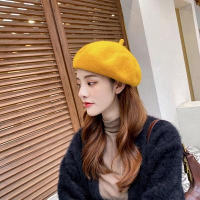 China Fashion Woven Low Price Casual Winter Beret Wool Plain Pom Pom Winter Hats For Women for sale