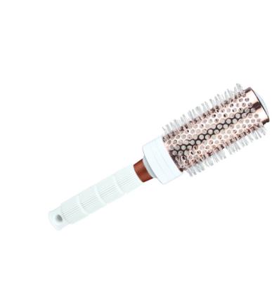 China Comfortable Healthy Comb Rose Gold Blow Drying Ceramic Hot Ion Thermal Barrel Brush for sale