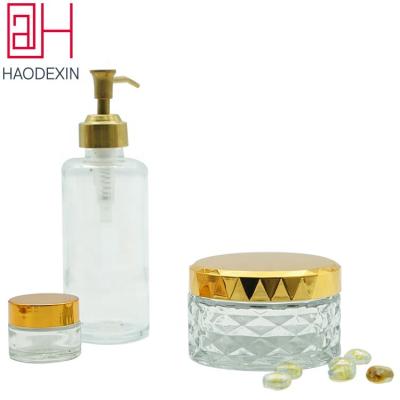 China HAODEXIN Personal Care Cosmetic Glass Container With Metal Screw On Lids Wholesale Clear 4oz Facet Cream Glass Body Scrub Jars For Skin Care for sale