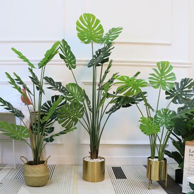 China Real Touch 10 Materials Leaves High Quality Eco-friendly PU Plastic Material Artificial Monstera Leaves Potted Tree Fake Indoor Plant Material for sale