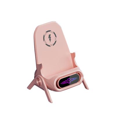 China Luxury Safe Wireless Charger Dock Sound Amplification LED Indicator Trendy Mini Chair Design Phone Charging Holder for sale