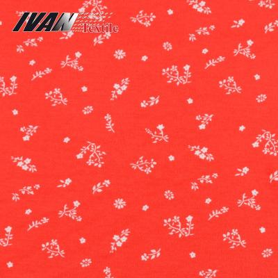 China Stretch Garment Textile Orange Red Flowers Knit Crepe Custom Printed Viscous Stretch Spandex Fabric For Dress for sale