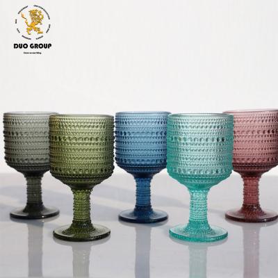 China Colorful Water Goblets Vintage Inspired Pattern Embossed Vintage Glass Etched Wine Color Glass Goblets Color Wine Glasses for sale