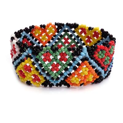 China Women's Fashionable Colorful Elastic Handmade Tiny Heart Bracelet Stretch Bead Bohemian Strand Bracelet Ethnic Adjustable Jewelry for sale