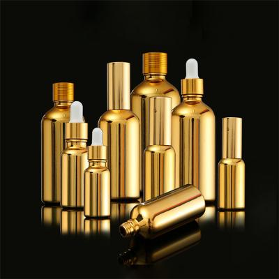 China TOSUN Cosmetic 5ml 10ml 15ml 20ml 30ml 50ml 100ml Empty Round Glass Bottles Essential Oil Serum Gold Dropper Bottle Packaging Supplier for sale