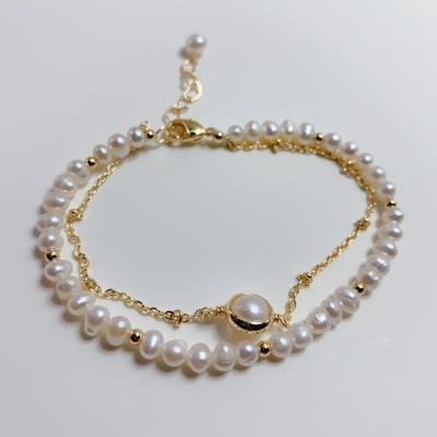 China Popular Tasty Double Layer Bracelet 14K Gold Plated Jewelry Personality Charm Natural Pearl Chain Bracelet for sale