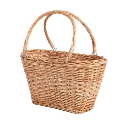 China Sustainable Natural Handmade Wicker Rattan Storage Basket New Product Handicraft Wicker Gift Baskets Hand Baskets With Handle for sale