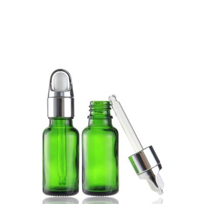 China Round 20ml Cosmetic Green Essential Oil Dropper Glass Bottle With Basket Gold Silver Dropper for sale