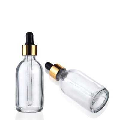 China 24K 1oz 30ml 50ml Clear Essential Oil Serum Bottle Glass Boston Dropper Cosmetic Luxury Bottles With Gold Lid for sale