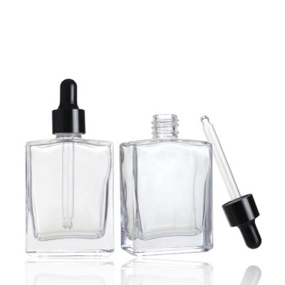 China Square 50ml Essential Oil Cosmetic Empty Clear Glass Perfume Dropper Bottle With Black Dropper for sale