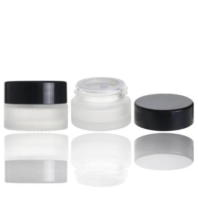 China 5g Skin Care Small Clear Cream Cosmetic Frosted Glass Jar With Black Lid for sale