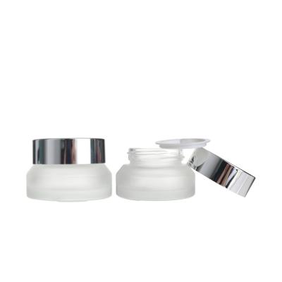 China Wholesale Cosmetic 15g Clear Frosted Glass Skincare Cream Cosmetics Jar For Skincare Container Packaging With Silver Cap for sale