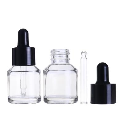 China Shoulder Cosmetic Skin Care Slope 15ml Essential Oil Clear Glass Bottle With Black Dropper for sale