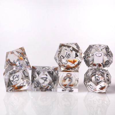 China Disturb free game dice Custom bulk 7pcs Dungeons and Dragons transparent Polyhedral Golden liquid core dice for sale