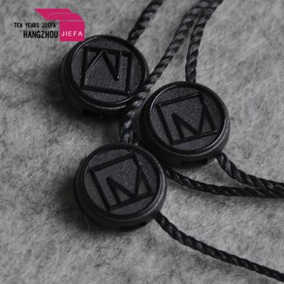 China Sustainable High Quality Custom Own Brand Embossed Logo Hang Tag Black Plastic Seal Label for sale