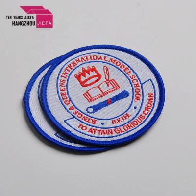 China Customized Colorful High Density Custom Embroidered Woven Woven Shape Overlock Viable Patch For Garments for sale