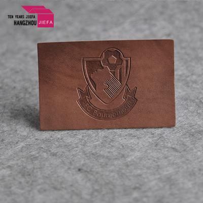 China Viable Wholesale Custom Logo White Debossed Leather Patches For Hat for sale