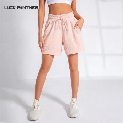 China Antibacterial Women Activewear Shorts Jacquard Cotton Drawstring Waisted Loose Gym Sports Running Shorts With Pockets for sale