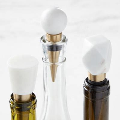 China Eco-friendly Wholesale Modern White Solid Marble Wine Stopper Fitted With Silicone Ribs for sale