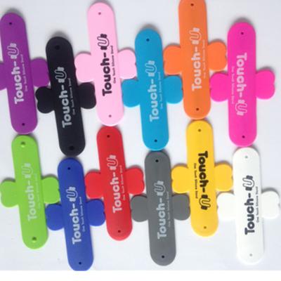 China Universal wholesale portable silica gel phone desktop stand, all kinds of color phone socket handle phone desktop stand for sale