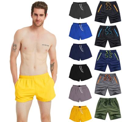 China Anti-Wrinkle Beach Clothes 2022 Summer Custom Size Hot Selling Polyester Elastic Gym Jogging 5 Inch Beach Surf Swim Inseam Shorts For Men for sale