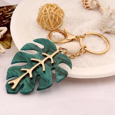 China Souvenir Gifts Promotion Hot Sale Green Leaf Shape Red Metal Stainless Steel Key Chain For Promotion Gifts for sale