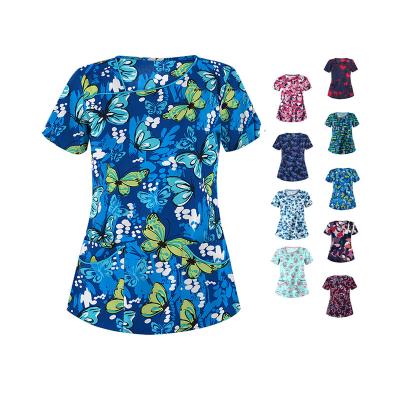 China Unisex Hospital Women Hospital Colorful Print Cute Cartoon Scrub Nurse Uniforms Tops Fitted Spandex Printed Nursing Scrubs With Logo for sale