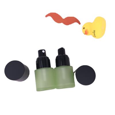 China Cosmetic Luxury Sample Pump Glass Bottle 20ml Frost Green Bottle For Foundation for sale