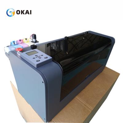 China OKAI t-shirt DTF printer A3 DTF white ink printer 30cm heat transfer PET film printhead xp600/ I3200 t-shirt printing machine for sale