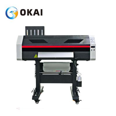 China OKAI T-shirt printing machine with pet film shaking powder machine drying white ink DTF for sale