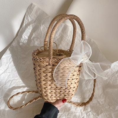 China Fashion Small Basket Tote Bag Straw Weave Handbag With Pearl Shoulder Belt for sale