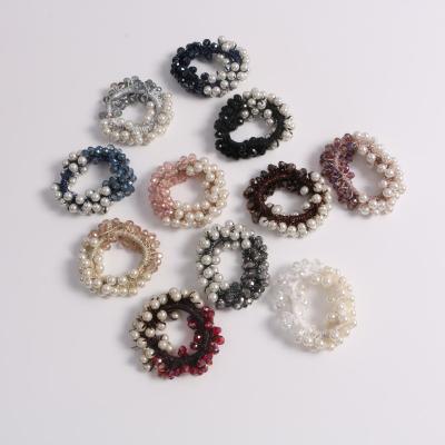 China Korean new cute women's hair color color hair rope pearl head crystal rope cute women's high value contrasting simple crystal hair ring pearl for sale