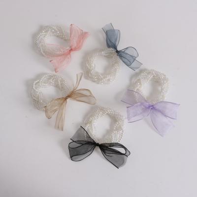 China 2022 new temperament hair rope organza hair bow tie girl pearl crystal head rope simple headwear Korean simple crystal head rope for sale