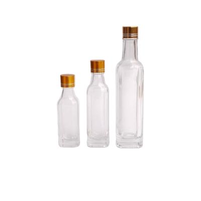 China Chinese High Quality Whole Beverage Gold Lid Glass Square Essential Oil Bottle for sale