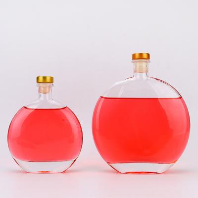 China Beverage Made From China Top Quality Many Size Round Glass Flat Empty Wine Bottle for sale