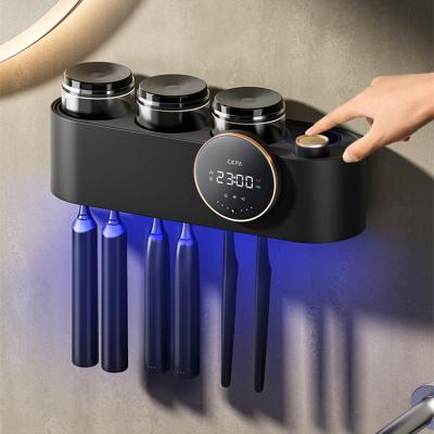 China 2022 Newest Bathroom Solar Powered Wall Mounted Rechargeable Toothpaste Dispenser 3 Cups Sterilizer Disinfector UV-C Holder Toothbrush Holder for sale