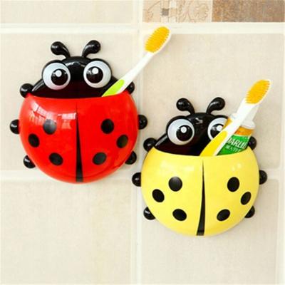 China Hot Selling Cheap Household Wall Sucker Suction Bathroom Ladybug Toothpaste Toothbrush Holder Viable for sale