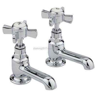 China Traditional Cross Handle Pillar Basin Taps Hot And Cold UK Sink Pair Faucets for sale