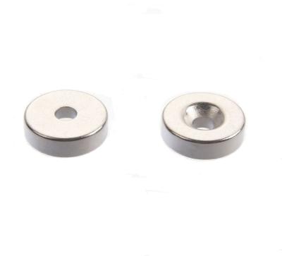 China N52 industrial round disc magnet nickel zinc neodymium super strong magnets prices with hole and screws for fixed machine for sale