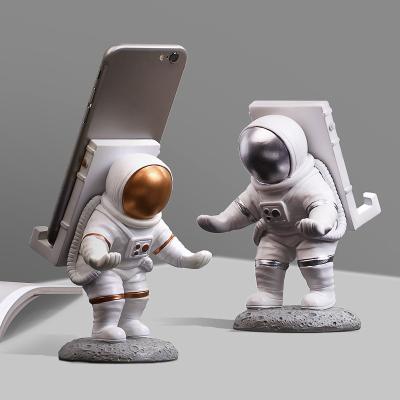 China New Global Arrives Cell Phone Holders Resin Astronaut Figure Outer Space Themed Gift For Party Home Decor for sale