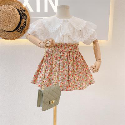 China 2021 new sweet girl's summer dress set 2pcs lace up soft top and floral set skirt suit kids clothing set for sale