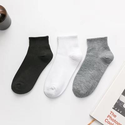 China New Breathable Black, White And Gray Sports Men's Socks High Top Casual Solid Color Mid-Tube Regular Socks for sale